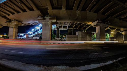 View of bridge in city at night
