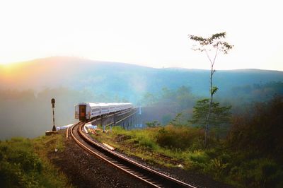 Train on railroad track against sky