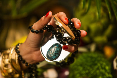 Close-up of woman hand holding eyeglasses