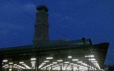 Low angle view of tower against blue sky