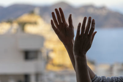 Close-up of hand against blurred background