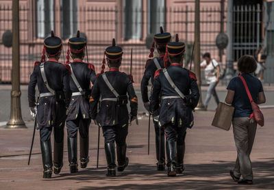 Rear view of guards marching on plaza de mayo