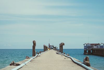 Pier over sea against sky