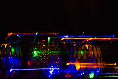Close-up of illuminated lighting equipment at night
