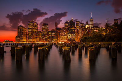 Scenic view of illuminated cityscape at dusk