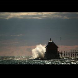 View of lighthouse against cloudy sky