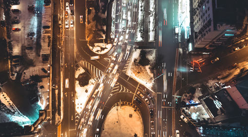 High angle view of illuminated buildings in city at night