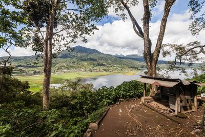 Scenic view of lake and mountains against sky