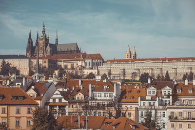 Buildings in city against sky