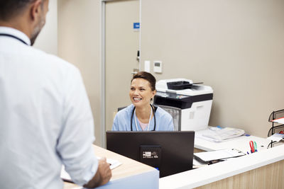 Doctors talking at hospital reception