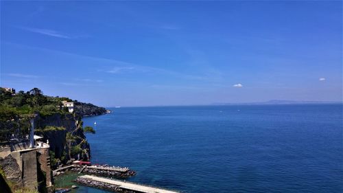 Scenic view of sea against blue sky