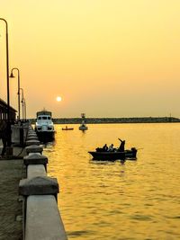 Scenic view of sea against clear sky during sunset