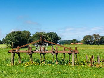 Fence on field against sky