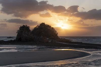 Scenic view of sea against sky during sunset