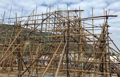 Low angle view of construction site against sky