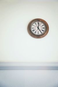 Clock over white background