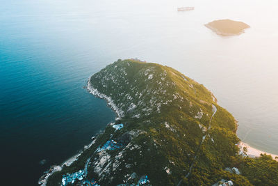 High angle view of rocks by sea