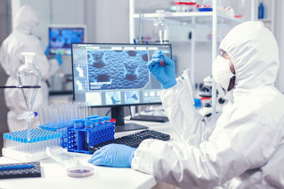 Scientist examining chemical in laboratory