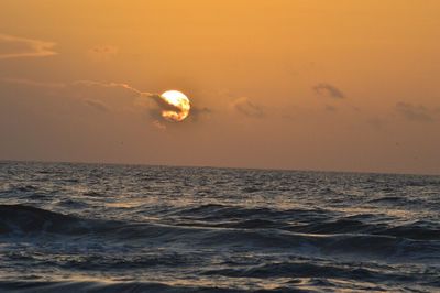 Scenic view of sea against sky at sunset