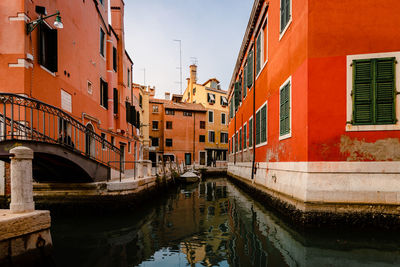 Typical canal in venice with colorful houses