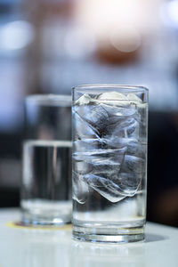 Close-up of ice tea in glass on table