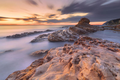 Scenic view of sea against sky during sunset