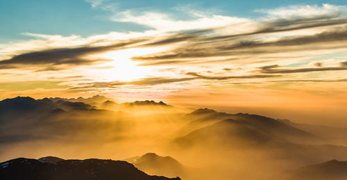 Scenic view of mountains against sky during sunset