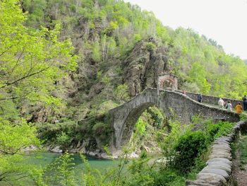 Scenic view of bridge over mountain