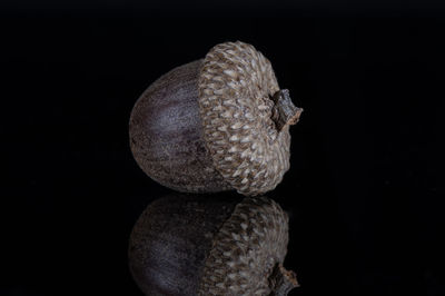 Close-up of fruit over black background