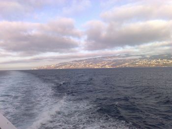 Scenic view of sea against cloudy sky