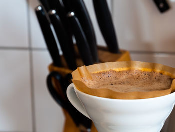 Close-up of coffee cup on table