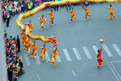 High angle view of chinese new year parade on street in city