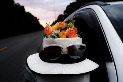 Close-up of red roses in car