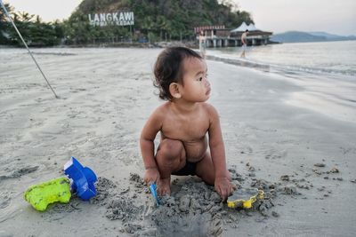 Boy with toy on beach