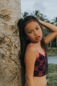 Portrait of girl standing outdoors