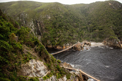 High angle view of rocks by sea