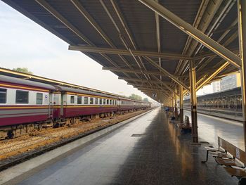 Train at railroad station against sky