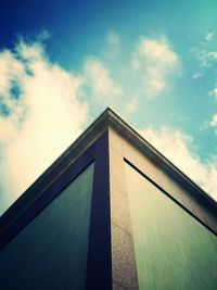 Low angle view of building against cloudy sky