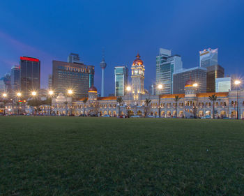 Illuminated buildings in city at night