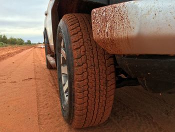 Close-up of tire track on dirt road