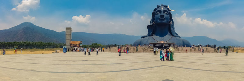 People at observation point against sky