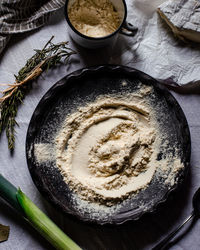 Directly above shot of flour in plate on table