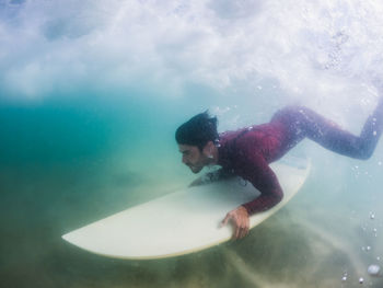 Man swimming in sea