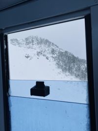 Close-up of snow covered window
