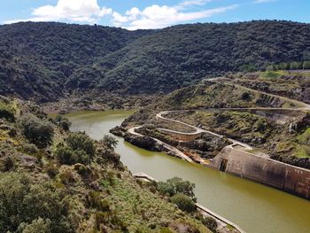 High angle view of canal amidst mountains