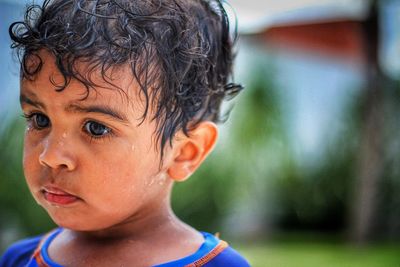 Close-up portrait of boy looking away