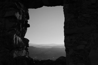 Low angle view of rock formation against clear sky