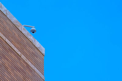 Low angle view of building against clear blue sky