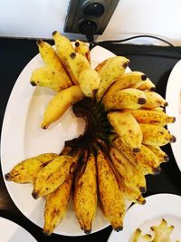 Close-up of yellow fruit on plate