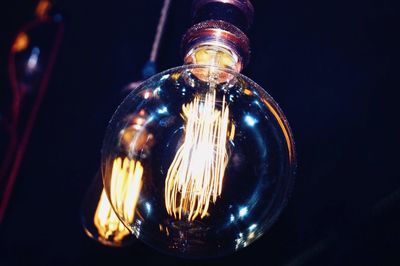 Close-up of illuminated light bulb